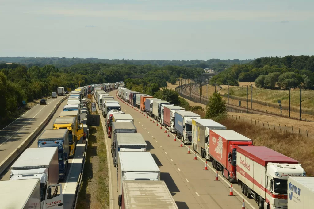 Image of multiple trucks on the road to denote unified logistics platform