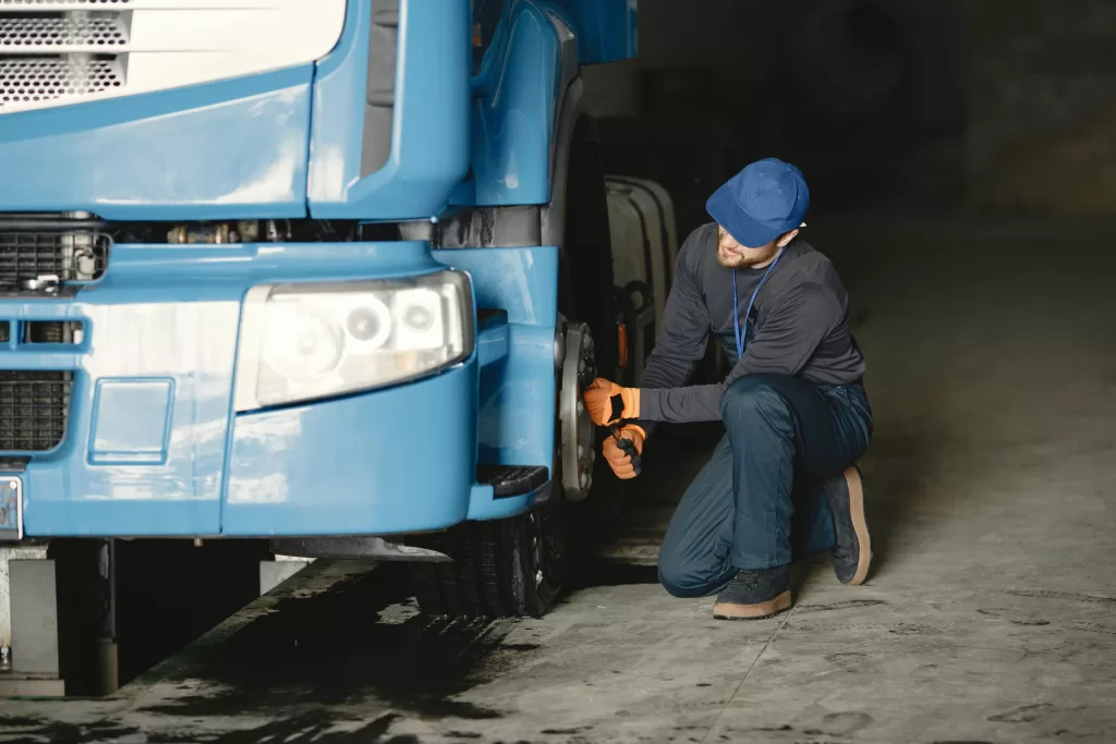 Image of a person making truck repairs